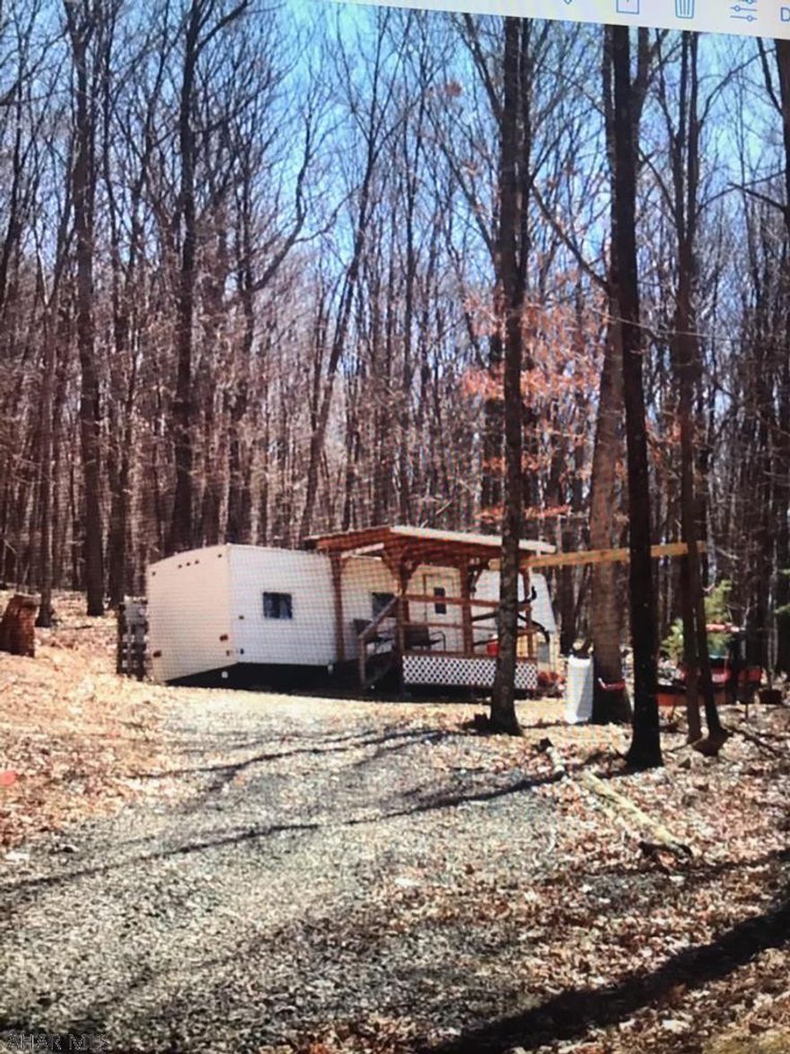 Nice parcel with access to State Game Lands. Electric and camper on property. Camper needs some TLC or could be removed from the property and you could build your perfect cabin or residence.