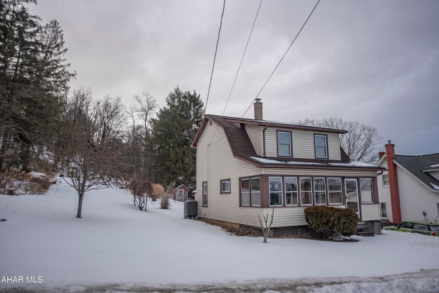 Move in ready 2 BR 1.5 BA  cottage style home located in a quiet neighborhood.              Beautifully remodeled within the last few years. The first floor has all new drywall ,new kitchen counter tops, new flooring throughout house, updated bathrooms, ceiling fans installed, central air, heat pump, water heater ,new windows, new back porch roof and water softener. Detached garage with lots of extra space and cabinets for workshop. Large rolling back yard with 2 sheds.