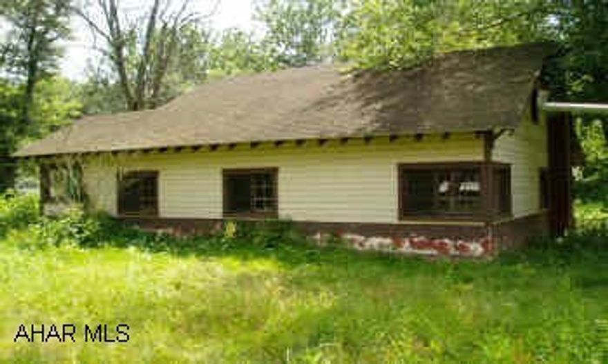 River front cottage, 1.5 story, contains 4 rooms and full bath on 1st floor. Open loft on 2nd floor. Over 200' river frontage. Investor/contractor project, well built structure. Designed to be raised above flood level. Exceptional location and lot.  If sold within 90 days of contract, seller offers $250 bonus to selling agent.