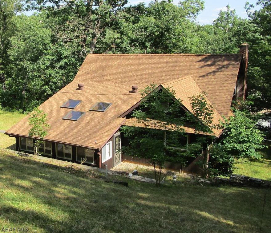 Don't pass this house by!!! Spacious 3 bedroom home with one bath. Large bedrooms. Den/Office. Heated season room with skylights. Living room with stone wall fireplace. Bay window in the dining room. Partial finished basement with family room and laundry room with slob sink. 1 car integral garage.  1.75 acres with in-ground pool with pool house.