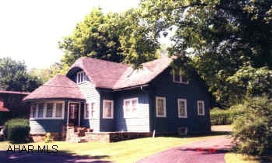 1.5 STORY BUNGALOW WITH DETACHED 2 STORY GARAGE. CHARMING 4 BEDROOM HOME ON LOVELY CORNER LOT. 1ST FLOOR BEDROOM & POWDER ROOM. FIREPLACE WAS WOODBURNING. CIRCULAR DRIVEWAY. HARDWOOD FLOORS.