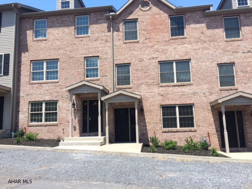 Beautiful new condo with granite, hardwood, tile.  1 car garage and deck off kitchen. No condo fees.