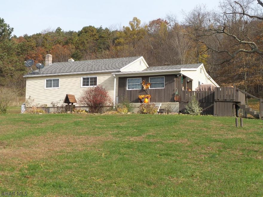 If you are looking to be out in the country with space, this is it!  Very well maintained 4 bedroom with large living room and family room.  Hardwood and tile flooring, each bedroom has closet space.  Large, almost 2 acre lot with mountain views.