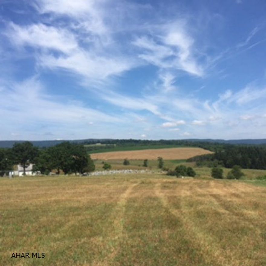 Build your dream home on this beautiful lot with views on all sides. Lot is already has a conventional septic system and utilities. Well will need to be drilled. Deed restrictions do allow modular to be built on this property.