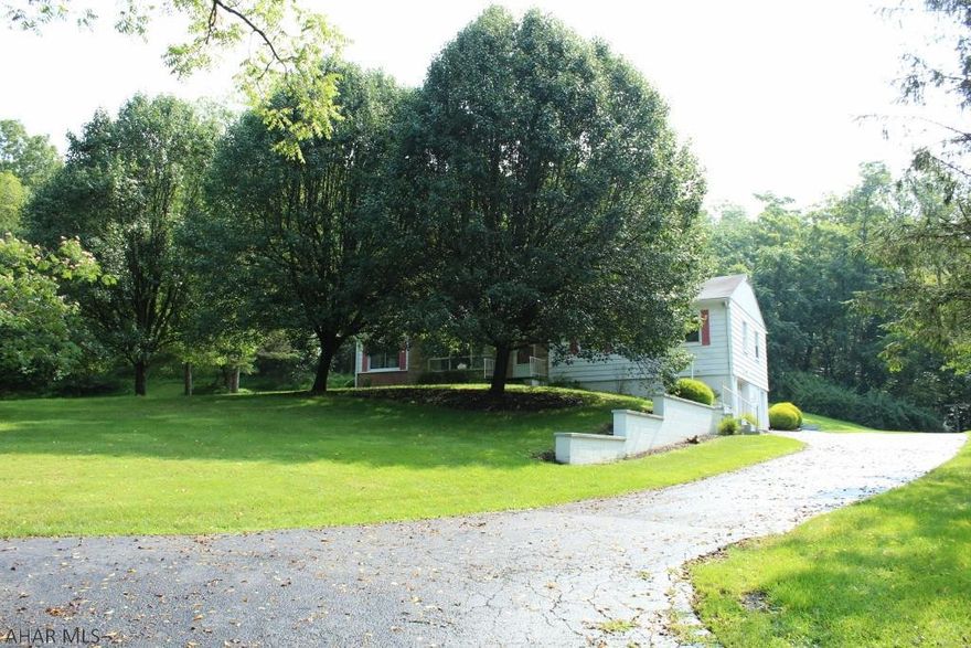 This Ranch Home sits on a little under one acre. When the leaves are off the trees, you can see all of Bedford. Built in 1954 with quality craftsmanship, this home was filled with much love. Mature trees and landscaping outside, private yet so close to town. 3 bedrooms all with hardwood floors, hardwood floors under the living room and dining room carpet as well. Inviting wood fireplace in the living room, enclosed side porch finished and made into extra living space with light and airy comfort. Cozy kitchen with a back door leading to an enjoyable screen porch area. Endless possibilities in the basement, laundry is located there as well as a half bath. Black top driveway, 2 zones Hot water baseboard heat and central air. Come and see, make this your new home!