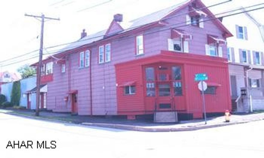 Large 2 unit building. Large open 1st floor formerly used as hardware store with workshop, but could be converted into apartment. 2nd floor apartment has lots of potential including kitchen, 3 rooms, & bath. 2 car garage. Large 2 unit building. Large open 1st floor formerly used as hardware store with workshop, but could be converted into apartment. 2nd floor apartment has lots of potential including kitchen, 3 rooms, & bath. 2 car attached garage.