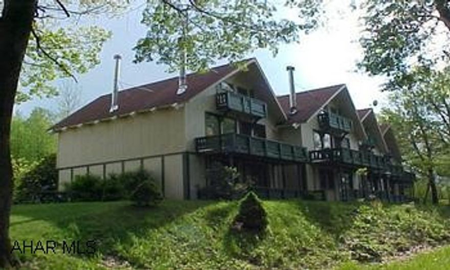 Furnished 2 bedroom condo with loft, 2 decks, wood stove, golf, indoor & outdoor swimming, and tennis courts.  # J-872 Greenfield Twp. Furnished 2 bedroom condo with loft, 2 decks, wood stove, golf, indoor & outdoor swimming, and tennis courts.  # J-872.  Greenfield Twp.