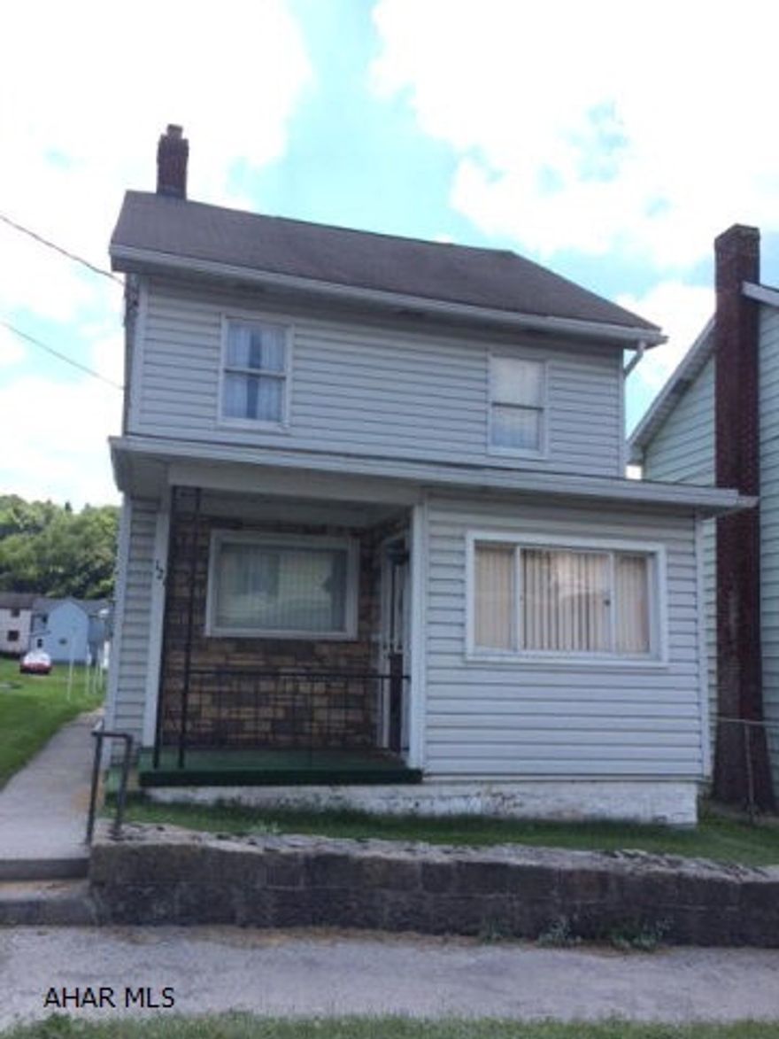 This home has an enclosed porch that leads into a mudroom, Large Kitchen has Laundry hook ups and half bath. Brand NEW 3/4 bath off dining room! Newer siding, newer furnace, Garage for off Street parking. Must see! Motivated seller.