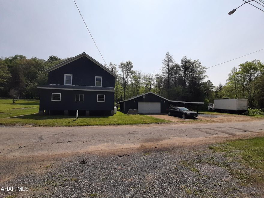 Great 4.54 acre lot with house and garage, right next to the Ghost Town Trail Head! This home offers 4 plus bedrooms and 2 bathrooms, living, dining, kitchen, and laundry rooms. The home does need some repairs. Multiple projects have been started but never finished. The garage offers two parking spots plus a side carport and covered wood storage in the back for the wood burner in the house. The garage also has heat and electric. The acreage has been thinned out to offer great wildlife views, Call today to make this one your own!