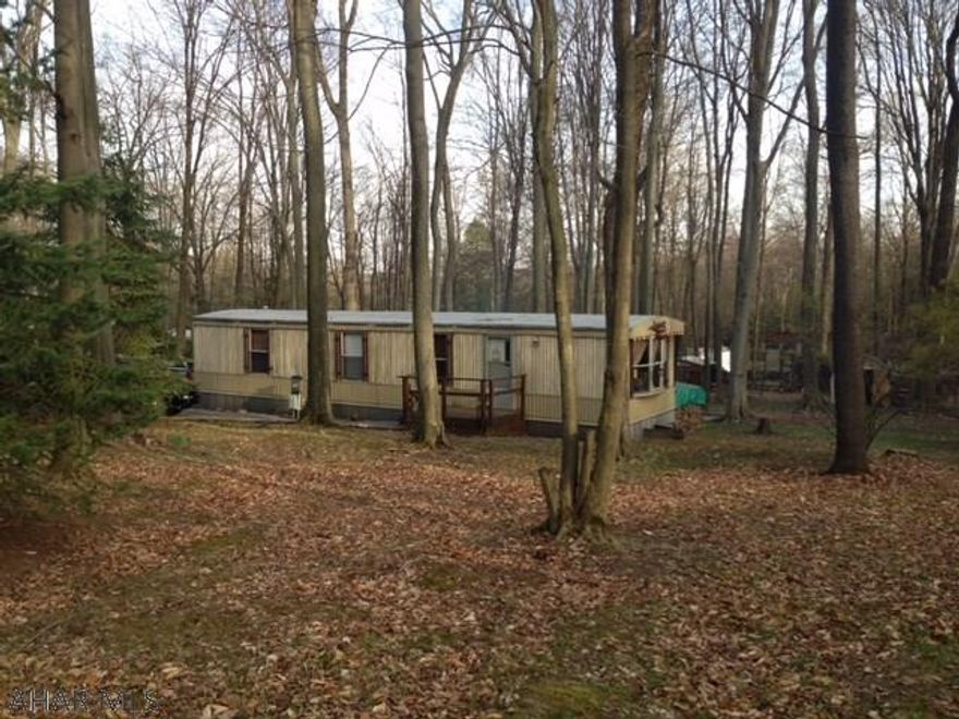 Calling all hunting groups or large families that like to vacation together!  This property sleeps 12 without sleeping bags and cots.   Eat in kitchen with an open floor plan into the living area.  Adjacent family room with wood stove offers extensive room for everyone.  Outside sit around the fire, burn a hot dog and tell a few hunting stories.  Half circle drive has parking for cars, ATVs and other toys.  All of this is located in Glendale Yearound, a gated recreational community.  Community swimming pool, tennis/basketball/volleyball, playgrounds, dog park, club house and planned activities.  Glendale Yearound is adjacent to Prince Gallitzin State Park / Glendale Lake / State gamelands 108.  Six miles from Rock Run ATV park.  If you love the outdoors and a good deal, look no further.