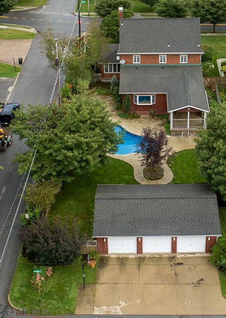New Price.  You'll love the $80k pool & patio area that was installed in 2015.  Yes, this in-ground, salt-water pool has a self-cleaning vacuum system in the floor.  The heat for the pool comes in from the bottom jets that help clean the pool. This brick beauty boasts old-world charm mixed with modern amenities. Features:  open kitchen/nook/family room, hardwood floors, arched french doors & front door, wrought-iron and wooden staircase, dark woodwork and doors throughout, and glass door knobs.  This well-landscaped, corner lot is fenced in the back.  When the weather starts to get cold, warm up beside the fireplaces in the living room and family room.  You'll undoubtedly appreciate having the 3-car garage when the snow starts to fall.  Tremendous Value!