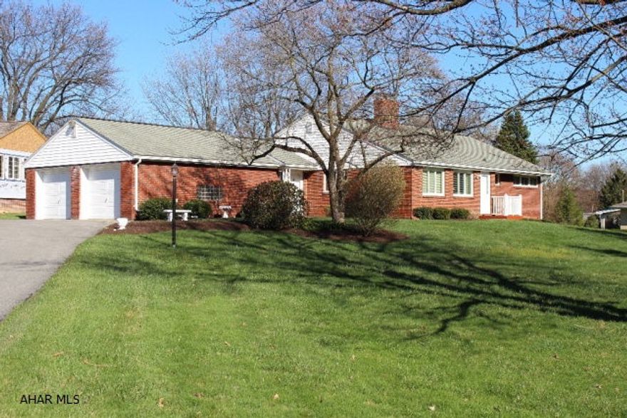 They don't make homes more solid than this.  Block construction and brick on a large corner lot in Sylvan Heights.  Lots of room and a galley kitchen.  Newer windows, an enclosed sunroom and 2 fireplaces set this rancher apart from the rest.  Full basement with a full bath ready for you to enjoy.  Large driveway with 2 car garage. Hot water heat with central air in this low maintenance home.