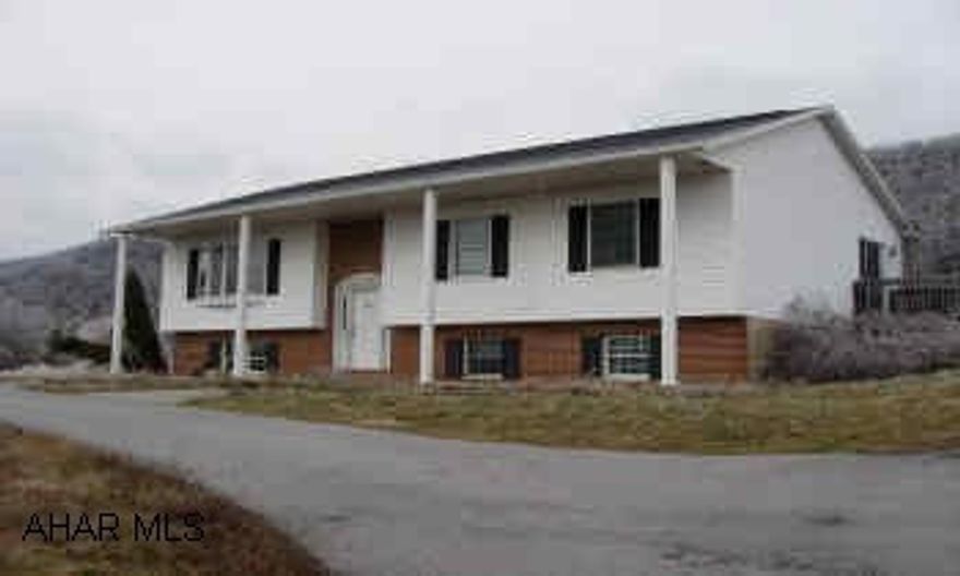 11 YEAR OLD BI-LEVEL ON OVER 5 ACRES.  TERRIFIC VIEW ON TOP OF THE HILL.  LARGE DECK WITH JACUZZI.