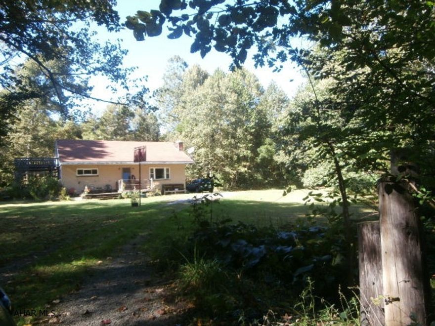 Beautiful wooded acreage on Sugar Run Road. Family owned since early 1900's. First time offered for sale! One story dwelling on site in fair condition. Sugar run is through property. Great for the buyer who prefers privacy yet is close to town. Good hunting. This type property is hard to find here.