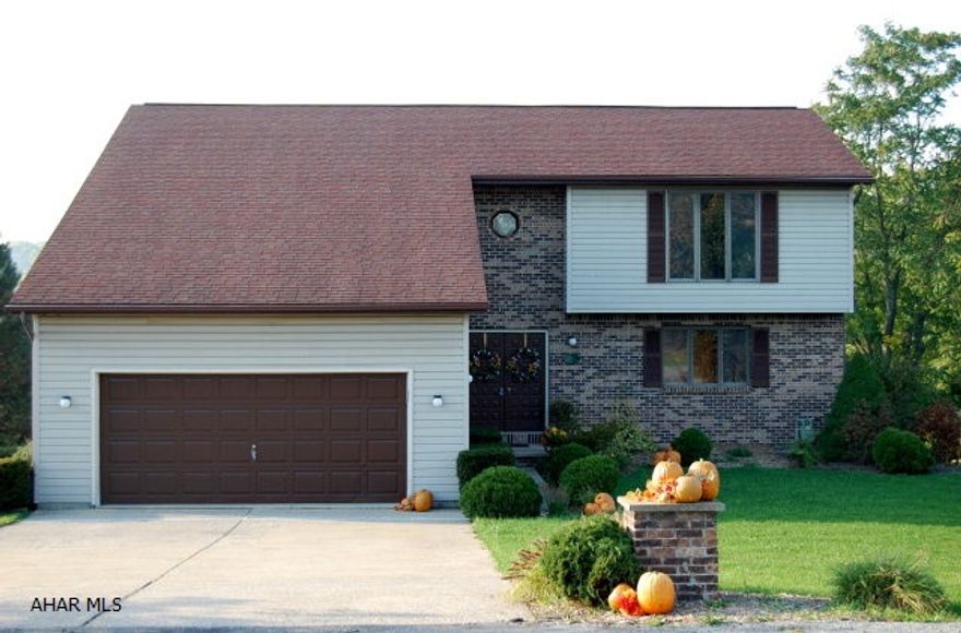 You can only own so many homes and these homeowners have two other residences so are willing to sell this home below market value for this area.  In a great neighborhood. This home is located in the Hallowdale Estates and is move in ready. All the rooms are of significant size and the square footage of the home is approximately 2400 feet which includes all three levels.The sunroom is absolutely incredible along with the view.  Third garage stall in back is handy location for lawn mower and additional storage.  Entire house has just been painted with O-Voc paint which contains no chemicals. The second bedroom has been used as an office.  The desk in that room also can stay. All utilities are underground.New carpet has just been layed on the steps going to the second floor.