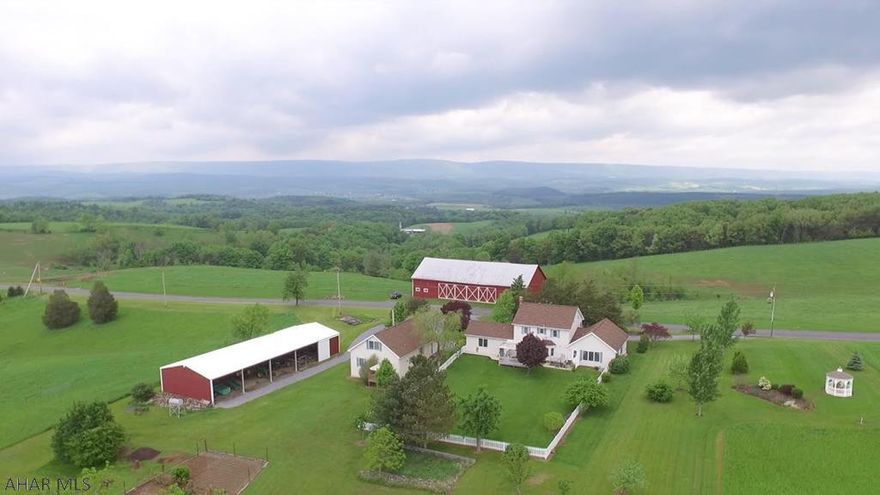 This incredible 197 acres beef cattle/horse estate has been meticulously maintained and restored by its present owners. Magnificent views enhance the country setting nestled in the Allegheny Mountains. No detail has been overlooked in the transformation of the impressive 4 bedroom, 4.5 bath home which offers a huge great room flanked by walls of windows, first floor master suite (handicapped accessible w/ high end walk in tub & many custom features). A lower level walk out basement and a separate bedroom guest house offers amazing possibilities. Multiple fenced pastures w/ yr round waterers, tillable acres, fishing pond, riding trails with views that will take your breath away, spotless barn and so much more. Click on Drone Video for enhanced viewing on this spectacular property.