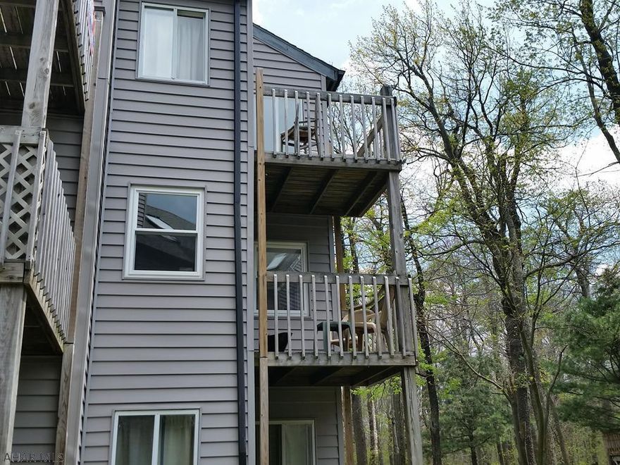 Nice 2nd floor fully furnished studio! new vinyl tilt windows, sliding door, tv, microwave, refrigerator & ceiling fan. Located across from the indoor pool.  Electric system is breakers.   $255/mo HOA dues include: outside maintenance, indoor & outdoor pools, hot tubs, wood for fireplaces + tennis court usage. 4-seasons resort: Golfing & skiing for a fee. J-436