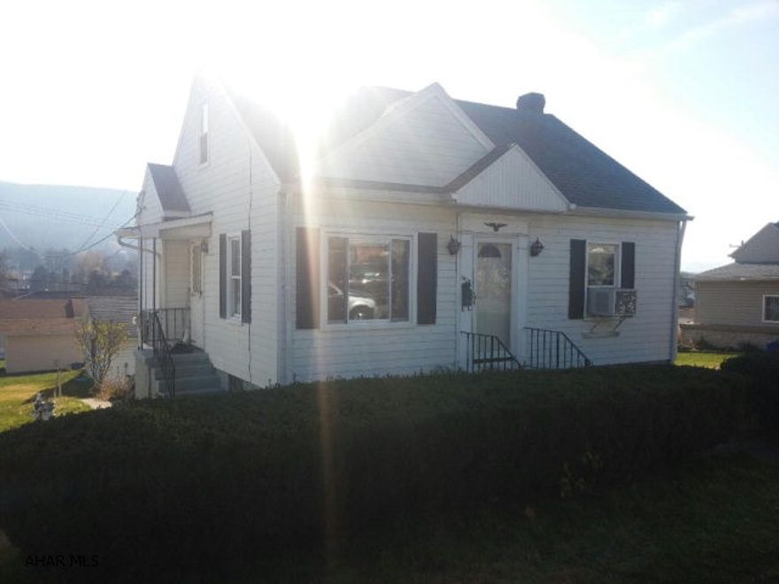 This is a Lovely 2 bedroom cape cod.  It has a rustic feel with wooden beams in living room area and open floor plan. The kitchen is nicely updated as well as the bathroom. There is a large back yard that leads to an oversized 2 car garage that is heated.