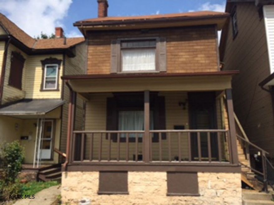 Both units completely remodeled with new kitchens, baths, carpet, drywall.  Tenants pay all utilities plus trash.  Stackable washer/dryer in each unit, tilt in windows.  New vinyl siding in back.  Great investment property close to hospital.  Low taxes.  Parking pad in rear for 2 cars.