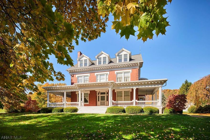 Step through time into this amazingly well maintained and updated, yet still marvelously classic home! Nestled on nearly 50 acres of pasture and woods, this all brick home features classic details such as inlaid hardwood floors, detailed trim and moldings, pocket doors, built in cabinets and shelves, brick fireplaces, and high ceilings. At the same time, you can enjoy a completely reconfigured spacious kitchen, a beautifully added enclosed three season sunroom, and a tastefully remodeled private office on the third floor. Entertain guests or relax on the pleasant patio off of the sunroom, or sequester yourself into a private study. Roam the landscape and find yourself passing time next to the pond. You can't find more possibilities in one place with this historic pastoral home!