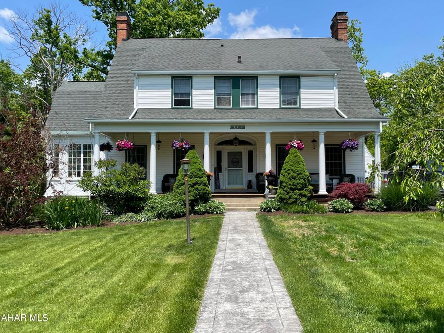 This is a rare opportunity to acquire a grand home in one of the most desirable areas of Hollidaysburg, combining personal privacy with close proximity to all amenities. Originally constructed in 1920, it was remodeled and modernized in both 2005 and 2017 but has lost none of its Jazz Age charm. With 5 full bedrooms and 4 full bathrooms, with an additional half bath on the first floor, this expansive home is ideal for any growing or extensive family. A finished basement with a movie room, office, bathroom, and plentiful storage space fill out the rest of an impressive amount of room. In addition, the property's detached garage is beneath an efficiency apartment which includes a kitchenette and full bath, making it a comfortable living space for long-term guests. Solid hickory hardwood stretches across the entire first floor, locally sourced from the mills of central Pennsylvania; the second floor retains all of its original hardwood flooring. Beautiful crown molding accents the home's internal charm, extending from the first floor into the master bedroom upstairs. Included with the master bedroom is a large master closet, and an elaborate master bathroom with a walk-in shower and soaker tub. The kitchen is both modern and elegant, with customized cabinetry and quartz countertops. Laundry units can be found on the second floor, conveniently near the bedrooms. Three gas fireplaces located in the living room, sunroom, and basement only add to the home's appeal and unique character. Finally, a relaxing front porch of Brazilian hardwood adorned with lovely white columns and swing feels like the best of the Old South has been brought north exclusively for your comfort. A back patio and front walk with stamped concrete complete the outdoor visage which is sure to be a center of entertainment.