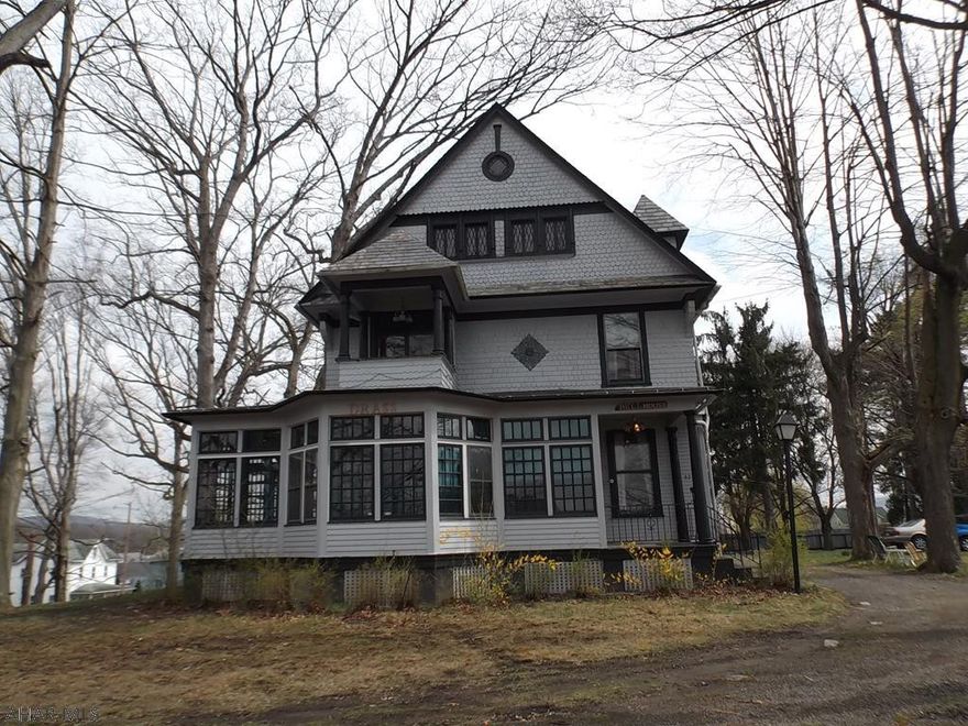 NEW PRICE...HUGE Victorian home!   4 Bedrooms, (plus 3 more rooms on 3rd floor)  1 Bath, 5 fireplaces (deceased owner never used!) One fireplace is triangle shaped and heats the dining room, living room AND hallway.  There is also a study. This home boasts STUNNING woodwork, including sculpted door transoms above doorways and beautiful stained glass windows and you should see the gorgeous staircase.  Hardwood floors are very nice as well.  Upon entering the home there is another "hidden" staircase that used to be used by the maids.  Zoning could allow business if interested (go thru proper channels)   Best of all it sits on over an acre of ground.  There is a security system in place (NO monthly fee) w/9 cameras.  You can download app and watch home from your phone.  CRYING FOR NEW OWNER!!