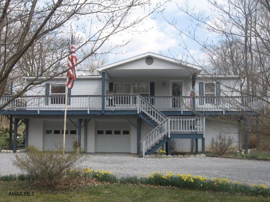 Great getaway on 1.8 acres!  The Juniata River is across the street and a golf course at the back of the property. Nice wrap-around deck. Raised ranch home w/2-car integral garage.  Rounded driveway w/nice landscaping. Property is lined w/trees. 3-4 Bedroom; 2.5 Baths. 2006-new doors; 2008-new flooring-ceramic tile and hardwood; 2010-new bath-ceramic tile & vanity.  Big windows -thermopane tilt-in. Kitchen has lots of cabinets - pantry; bar eat-in area on DR side; glass doors; desk area added. Master Bath has 5' shower w/seats; linen closet. Whole house generator (except stove/dryer). Ground level - finished BR/office & 1/2 bath. PF fam room w/door to back yard. Electric is $150/month. 20 min to Snyder's Run boat launch - easy access to Raystown Lake!!  Room for boats!!