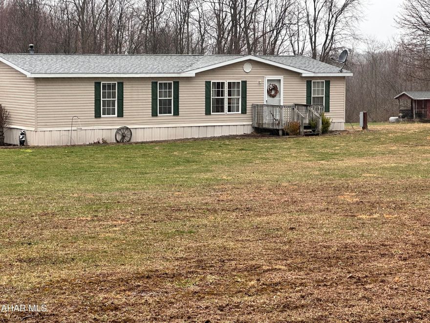 Wake up every day to the amazing view of the mountains! 2002 Doublewide on 2.3 acres with 28 x 35 detached garage with electric heat. Great country location, level yard, well kept home.