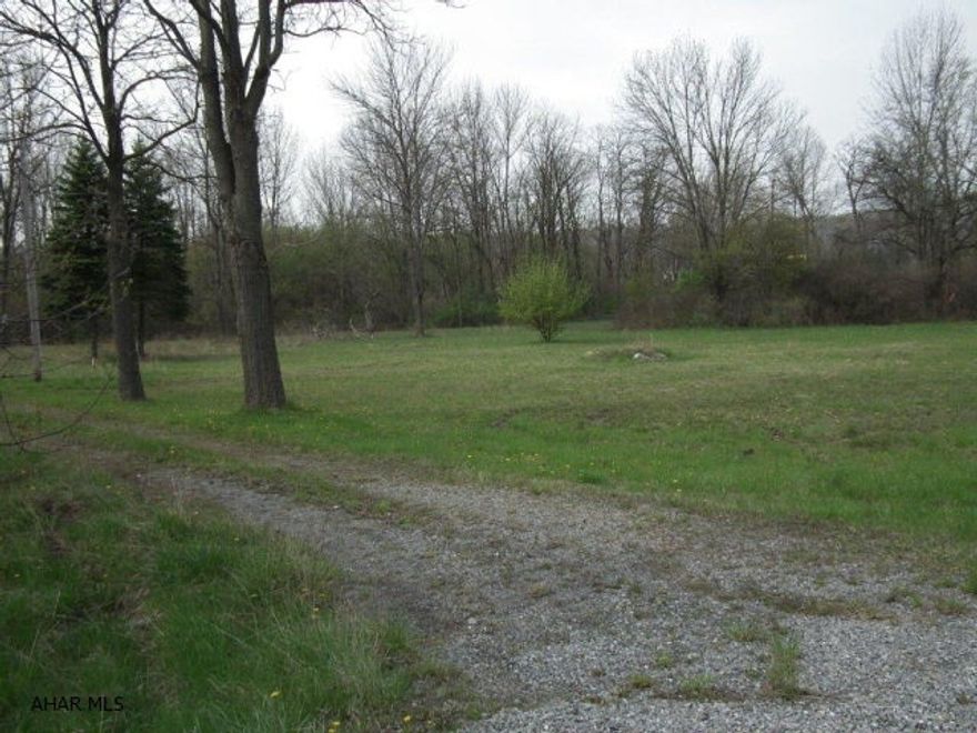 2 +/- acre is surveyed to separate from 3.63 acre lot. Municipal approval is pending.