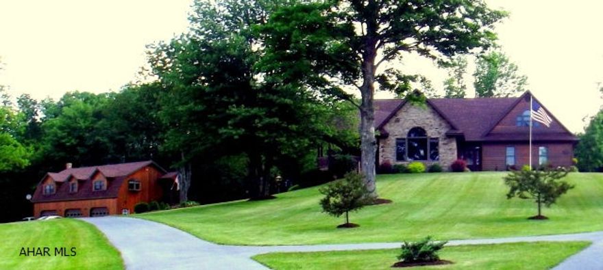 Two custom built dwellings surrounded by approx 10 acres. Main house has beautiful views, Custom staircase Hardwoods throughout 1st floor laundry Main house has two full and two half baths and kitchen with island Geothermal heat throughout. Fully rented Carriage house features 2 BR and 2.5 baths. 3 garage bays, large closets.  Former Bed and Breakfast  Close to St Francis University  Property very affordable at adjusted price