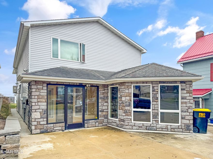 Take advantage of this rare chance to own prime commercial real estate w/ a stunning apartment in the center of Ebensburg, directly on W High Street! Previously used as an insurance office & art crafts shop, this well-maintained commercial space features a lobby w/ a front desk, a large office w/ plenty of windows, two additional offices, a break room w/ a kitchenette, a bathroom, & storage on the main floor. The upstairs unit boasts a large, spacious one-bedroom, one-bathroom residential apartment. Enjoy one off-street parking spot, additional borough-owned parking, on-street parking, a covered patio, a covered rear composite deck, & a spacious yard. Call now for more information and don't miss this incredible opportunity!