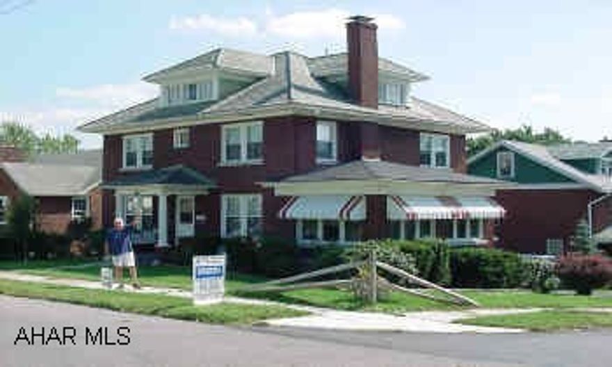 REDUCED!  IMPRESSIVE BRICK COLONIAL ON A CORNER LOT IN CALVERT HILLS AREA! 4 BR'S, 1.5 BATH, 2 FIREPLACES, FR,  2 CAR ATTACHED GARAGE, GOOD CLOSETS, HEATED SUNROOM, AND MORE. REQUEST MIKE MANGIA 941-3997.