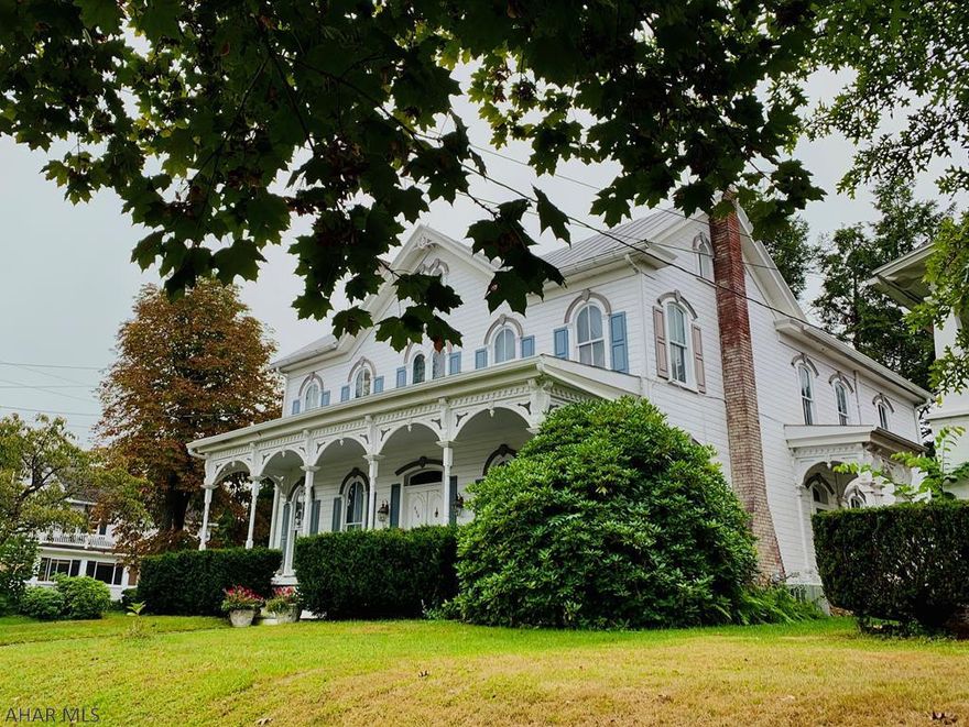 Imagine relaxing on this lovely covered porch overlooking one of Bedford's most beloved tree lined streets.  Friends & guests will be captivated as they enter the light filled rooms that are beautifully enhanced by the magnificent architectural details.  From the gorgeous crown moldings, newly refinished wood flooring and floor to ceiling rounded windows, this home exudes character.  Beautifully renovated kitchen with new cabinets, flooring, quartz countertops, stainless appliances plus a walk in pantry make this a chef's delight.  A main floor master bdrm/bath, a 2nd fl owner's suite and a stunning guest bedroom are some of the incredible details that one cannot overlook.  Energy efficient natural gas furnace and central air & 2nd floor laundry add to this tremendous value.
