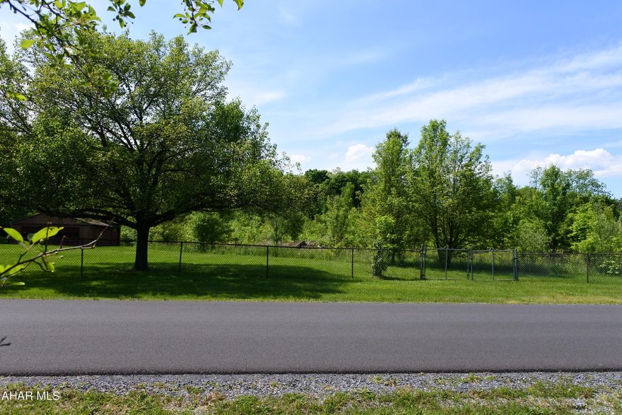 Hollidaysbsurg building lot. 3.28 acres, public water, sewer and gas are available. There is also a garage/shed on the property for storage.