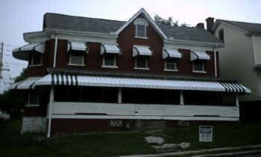 DOUBLE HOUSE. NEEDS WORK. ONE SIDE LIVEABLE, ONE SIDE IS GUTTED. LARGE BRICK DOUBLE HOUSE WITH LARGE FENCED YARD. COULD BE A NICE INVESTMENT PROPERTY. NEW ROOF, SOME NEW WINDOWS.