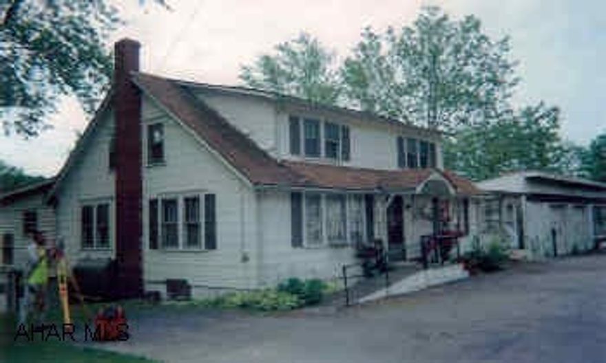 Commercial location on .913 acres, includes house (former store and residence)with detached 2-car garage. Super location along Mile Level. Perfect for retail business, office location, other uses. Priced to sell. LOCATION, LOCATION, LOCATION!!!