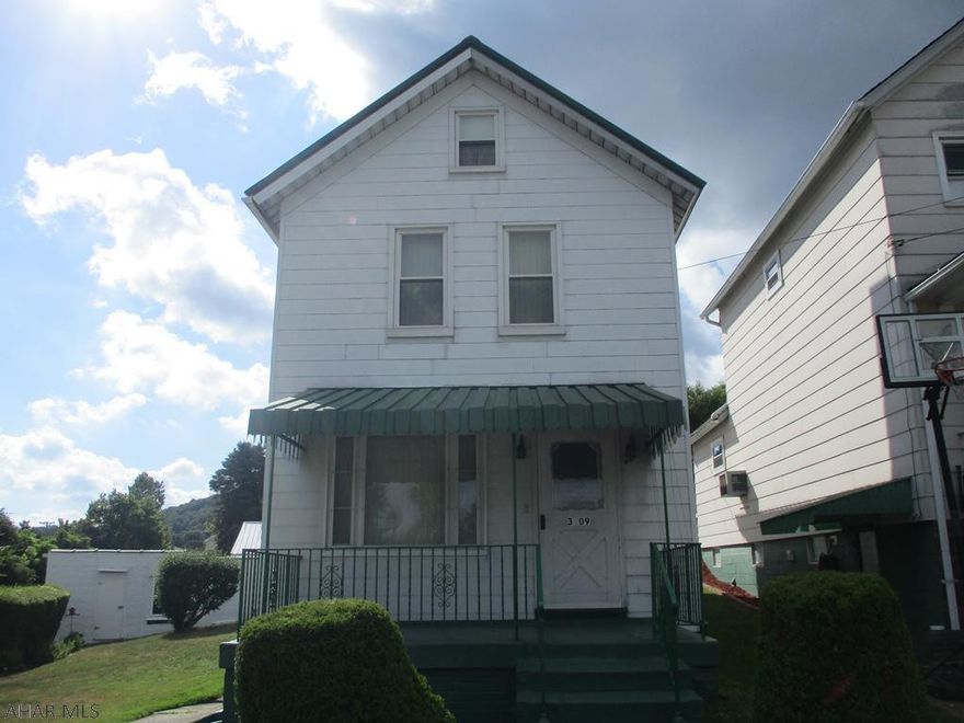 Extremely well maintained two story home on quiet block in Northern Cambria borough. Newer metal roof, thermopane windows and updated kitchen. Kitchen has updated counter top and blacksplash along with updated flooring. Woodwork has been meticulously maintained and hardwood floor under carpet throughout the house. This is a move in ready home with the refrigerator, stove, washer and dryer included with the property. Two car detached block garage with metal roof for off street parking or storage. Two new fuel oil tanks installed for heating. Walk out basement and coal miners shower with commode in the basement. Municipal required pressure test completed and passed. Ready to move in. Very clean home well kept home. Must see!