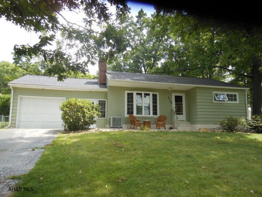 This is a lovely ranch home with updated kitchen, beautiful new baths, newly finished family room  with gas fireplace, hardwood floors, pretty natural stone wall with built in bookcases and gas fireplace in the living room .Relaxing back deck and large fenced  yard too ! Newer gas furnace and central air. Stay out of the weather going from the attached garage to the nicely finished breezeway...also serves as more living space and opens to front and back yards.