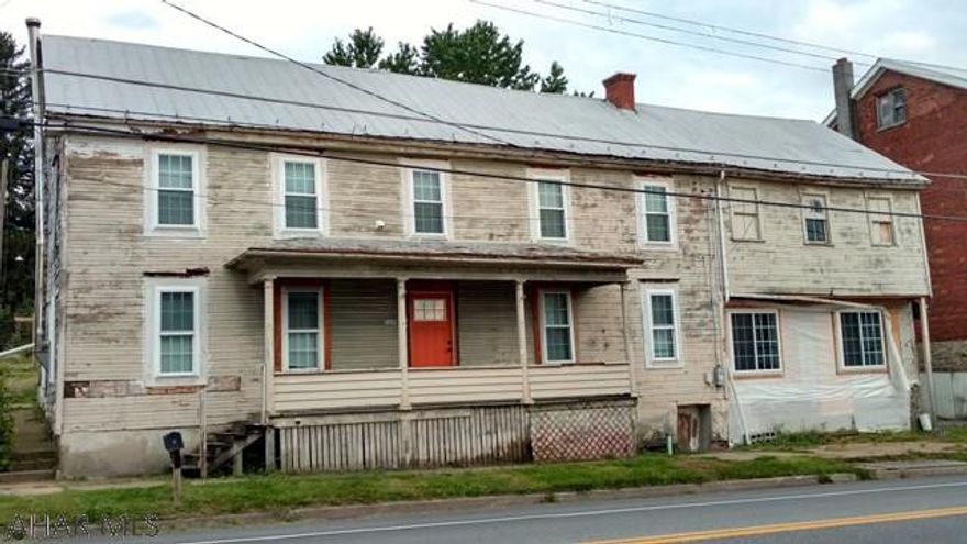 Many possibilities! Single family, duplex, live in one part, run a small business out of other side(?). One side gutted, rewired, insulated, drywall hung, but unfinished, other side is partially remodeled, living room, fireplace, off street parking, garage, finished property and make it yours! Call listing agent for appointment.