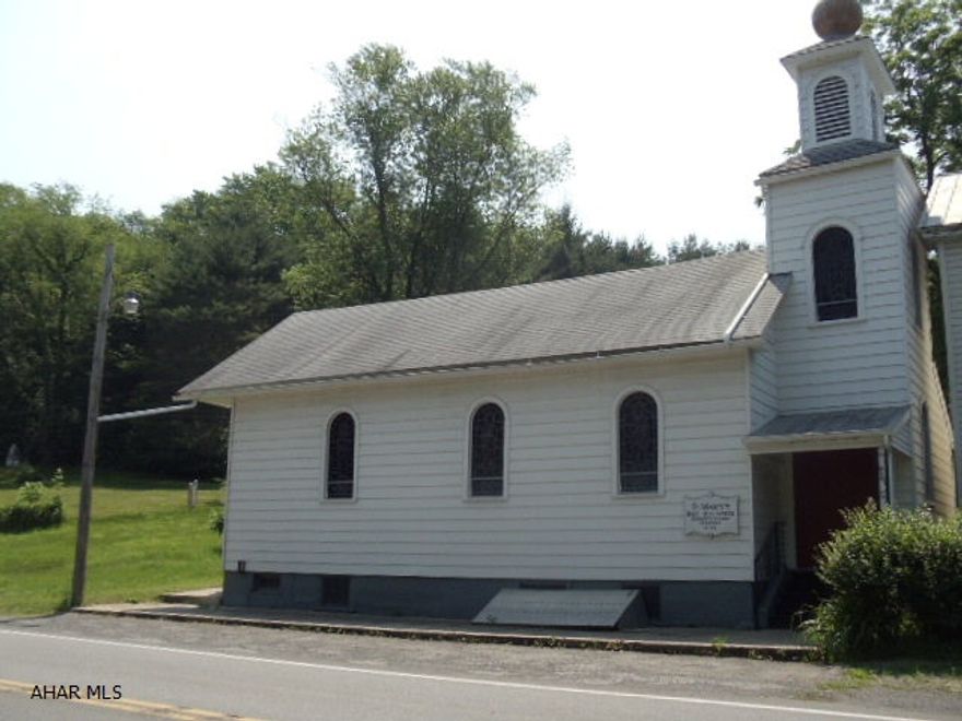 1.5 story building on outskirts of Williamsburg.  Approx 900 sq ft open room in 1st level with approx 250 sq ft loft area.  Previously used as a church.  Stained glass windows, bell, bell tower and cupola will be removed- other list of exclusions included with sellers disclosure.  Across from Rails to Trails walking path. Public sewer to the property - would need to be connected. J-078