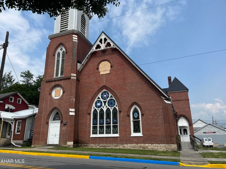 Beautiful Historic church in Downtown Everett.   This magnificent building still has some of the original characteristics of the original early church.  The stained glass windows, chandeliers, wood trim, sloped amplifying floor in sanctuary, pews specifically made to accommodate the angled floor, the bell tower with the original bell... This building offers lots of space, 2 stories, and a clean slate to put the business of your dreams, apartment building, theater, restaurant retail store, office building, a personal residence, or use it for multiple businesses and make it a mixed use building.   There is no limit to the potential of this great building.  It comes with 2 lots (parking area and the church) with 2 sewer taps, 2 water taps.  Electric, water, sewer currently disconnected.  Property previously had a fire from propane heater, being sold as-is where is and seller will make no repairs.