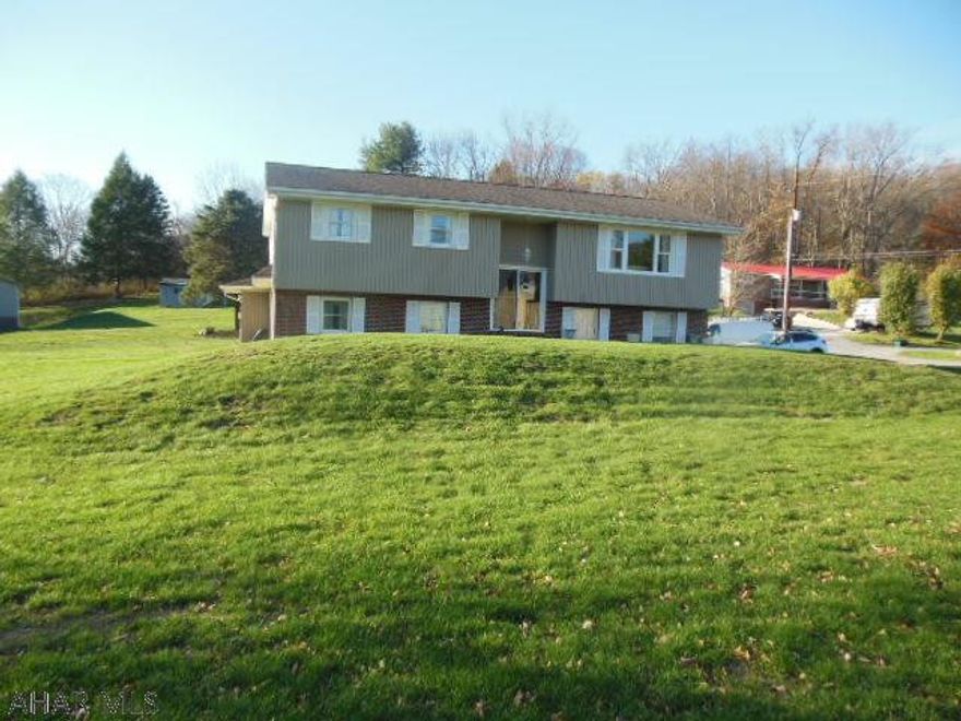 Exceptiional, move in condition. Bi-level in Bellwood, on 0.7 acres of level, manicured lawn w/white cement driveway. 4 BR, 2 BA, 2 single car garages attached. OFA w/central air, beautiful HW floors and includes appliances. Oak kitchen w/accent lighting. Exceptionally beautiful!