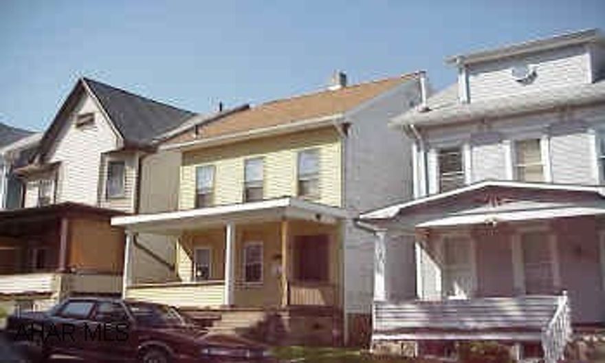 New roofing with soffit and fascia on house and both porches installed in May 2001.  Freshly painted, cleaned carpets, and some re-modeling done inside.  Finished 3rd floor is heated with electric heat and used as 3rd bedroom.  Laundry on 1st floor.  Ready to move in.  Off street parking.