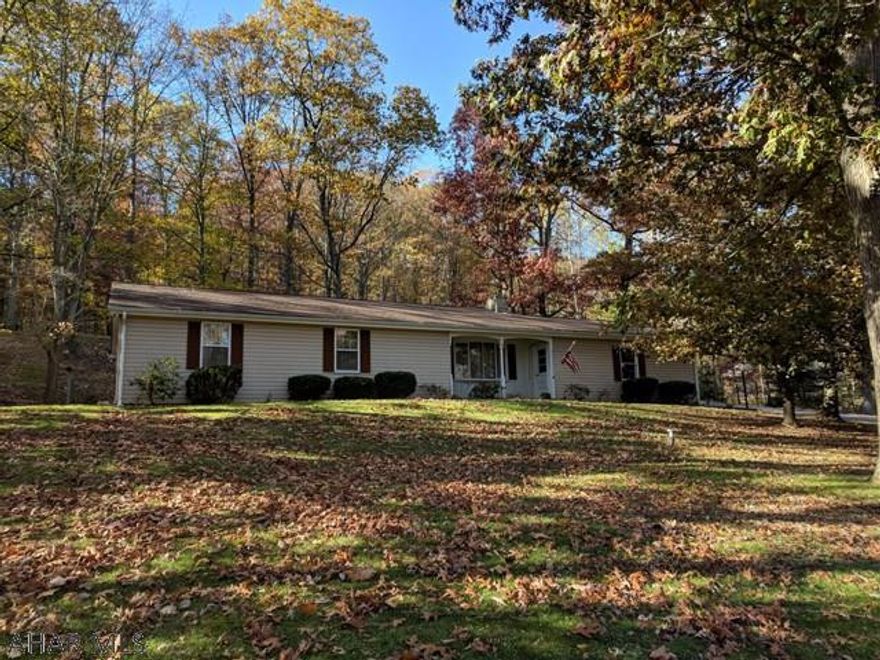 Here is the 3 bedroom 2 bath Ranch style home that has been in high demand in the Bedford area. Beautiful setting with extremely convenient access to US Hwy 220, and only 6 miles south of Downtown Historic Bedford! Paved driveway into the oversized two car garage.  Newer roof. Hook-up for a pellet stove in the basement. Large covered patio for entertaining and relaxing in this woodland area. Bring your design ideas and make this home into your own!