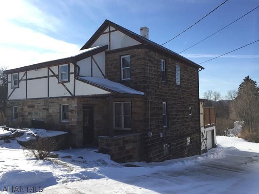 Agent Owned.  Solid home in a quiet setting.  Beautiful wood trim and stone exterior make this home warm and unique.  Back deck overlooks the valley.  Walkout basement provides access to the garage for easy, convenient living.  Formal dining room with wood accents.  New carpet throughout.  Come see this beautiful home.