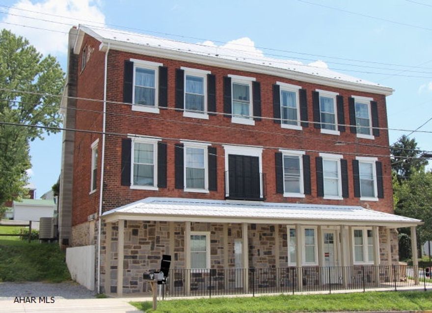 Minutes from Roaring Spring & Martinsburg! A must see Commercial/Multi-Unit Apartment building with total renovations! 4 Total Units! Two vacant units on lower level, one store front & one office. One large studio apartment on second level with separate bath $500 includes utilities. Spacious 2 bedroom 1 bath apartment on third level $700 includes utilities. Insurance: $2124/year Water: $98/unit/quarter (3 units due to commercial spaces sharing restroom) Sewer: $55/unit/month (3 units) Two unrenovated rooms used for storage. Zoned heating and central air in this beautiful 1800's brick building located in the heart of Woodbury. This property is on a large lot with tons of parking. Includes 2 wall ac/heat units, 1 window ac unit, 2 washers, 2 dryers, 2 refrigerators, 2 stove Motivated seller!