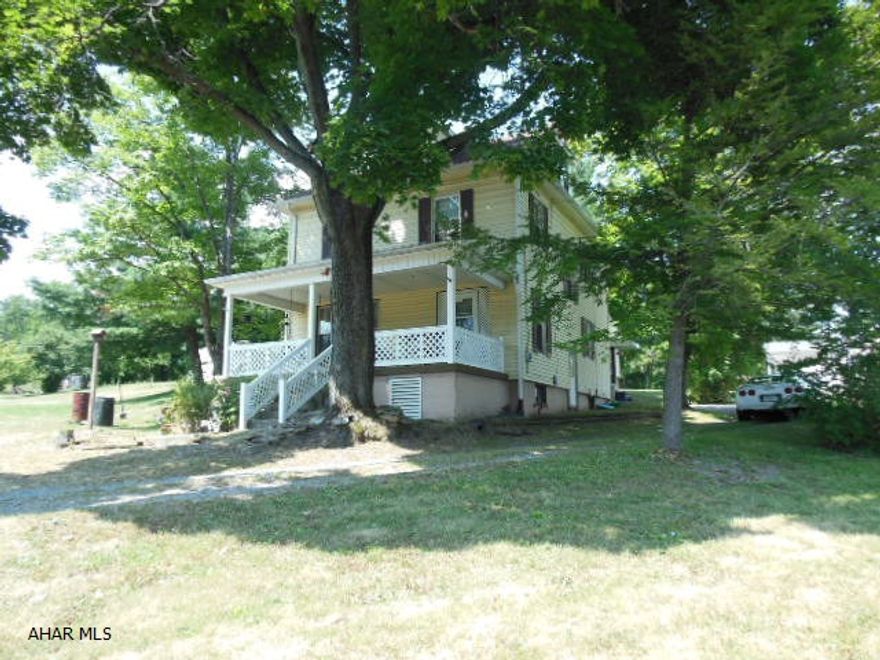 REDUCED!  Beautiful Setting / Beautiful Corner Lot!!  Older 2 story homestead on 1.12 acre corner lot with 4BR (w/attic that could be used as a bedroom), 1.5 baths, 1st floor laundry, updated furnace, with a 1+ car detached garage. Full basement-good storage and a high ceiling, etc. Good room to build another garage or home. Very nice setting! Some appliances. Low taxes-Logan Township. Make it your own! Also 2 working lawn tractors. Needs some work, but great value! One bedroom (largest) is stripped down to the plaster. The Seller will consider a reasonable offer...