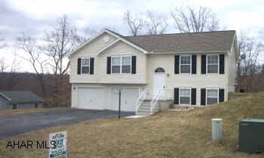 Immaculate 4 yr. old home in Reservoir Acres. Home features oak kitchen, family room in basement, and large deck that overlooks a large wooded lot.