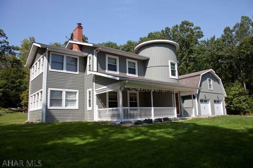Beautiful 2 story Dutch Colonial Farmhouse with a 2 car garage built in 1986 situated on 10 acres of wooded property at the end of a private lane. Includes 2 storage sheds. The house  had new windows and vinyl siding installed in 2015 as well as an updated kitchen and first floor bathroom. There are sunrooms located off of the first and second floors. A new outdoor patio with integral fire pit was added in 2015.
