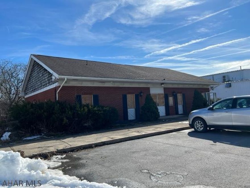 Solid brick one-story building for sale with large canopy with drive through. This well constructed building sits on a large lot in Eldorado section of Altoona. This building was previously a bank and still has vault and safety deposit boxes.